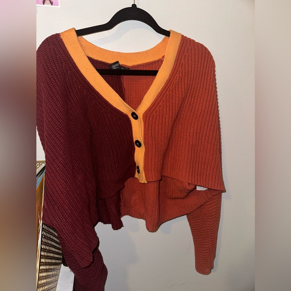 This is a cropped cardigan/ sweater button up From forever 21 😍